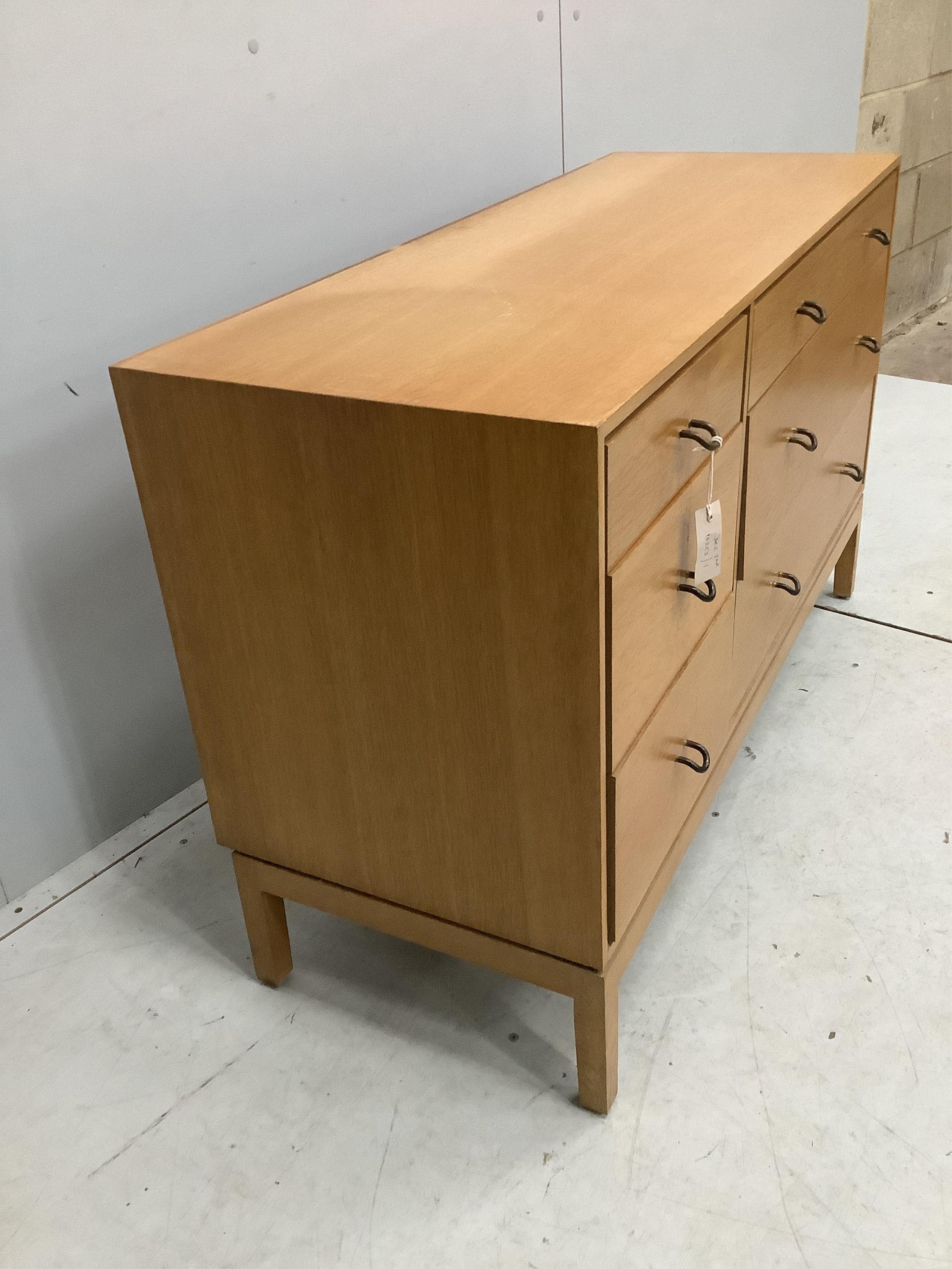 A mid century oak six drawer chest by John and Sylvia Reid, width 112cm, depth 43cm, height 70cm. Condition - fair